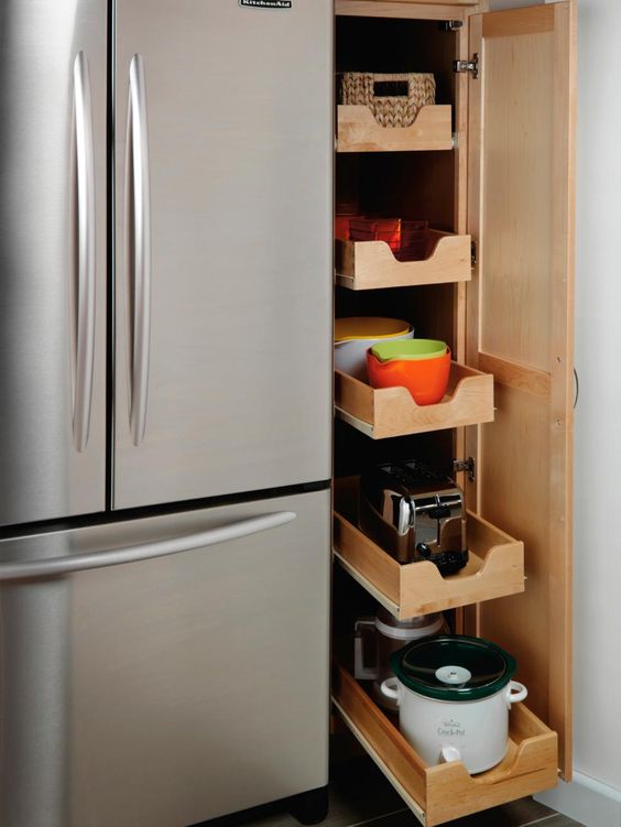 Efficient kitchen vertical storage idea with pull out drawers. #kitchen #storage #organization #cupboards #cabinets #shelves #decoratingideas #decorhomeideas #drawers 