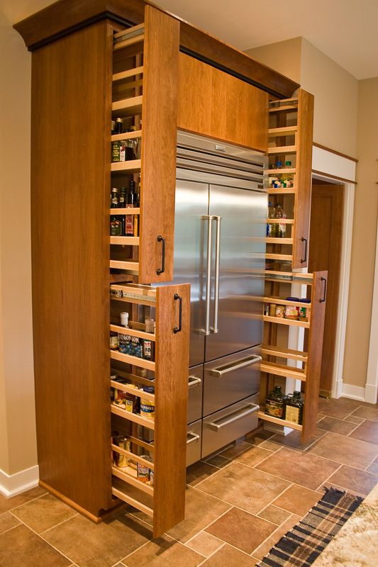 Pull out cabinet spice storage idea around the fridge. #kitchen #storage #organization #cupboards #cabinets #shelves #decoratingideas #decorhomeideas #drawer