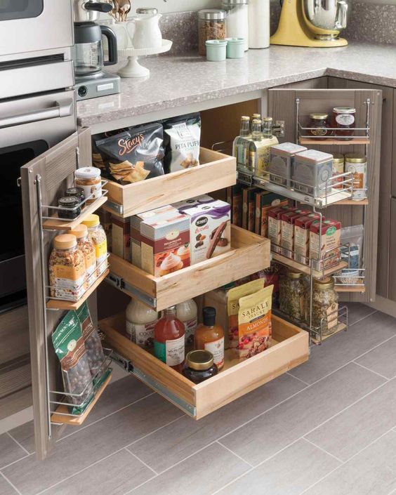 Small kitchen storage idea with pull out drawer and hangers on the doors. #kitchen #storage #organization #cupboards #cabinets #shelves #decoratingideas #decorhomeideas #drawer