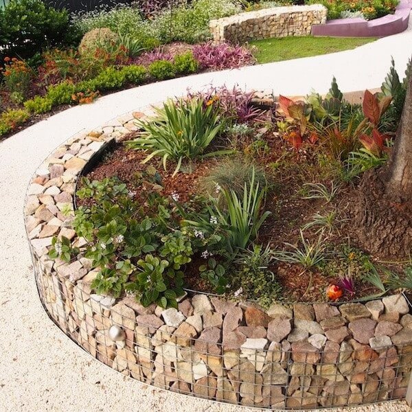 Raised Flower Beds with Stone Walls #lawnedging #lawnedgingideas #landscaping #gardening #gardens #gardenideas #gardeninigtips #decorhomeideas