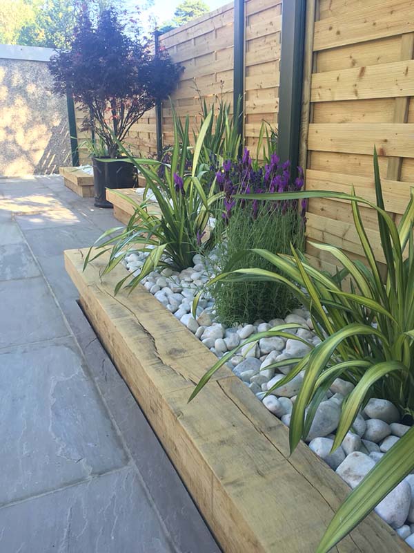 Wood Framed Low Water Garden in Stone #lawnedging #lawnedgingideas #landscaping #gardening #gardens #gardenideas #gardeninigtips #decorhomeideas