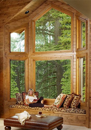 Woman relaxing reading a book in a wood cabin, reading nook #readingnook #nook #readingcorner #decoratingideas #homedecor #cozynook #decorhomeideas