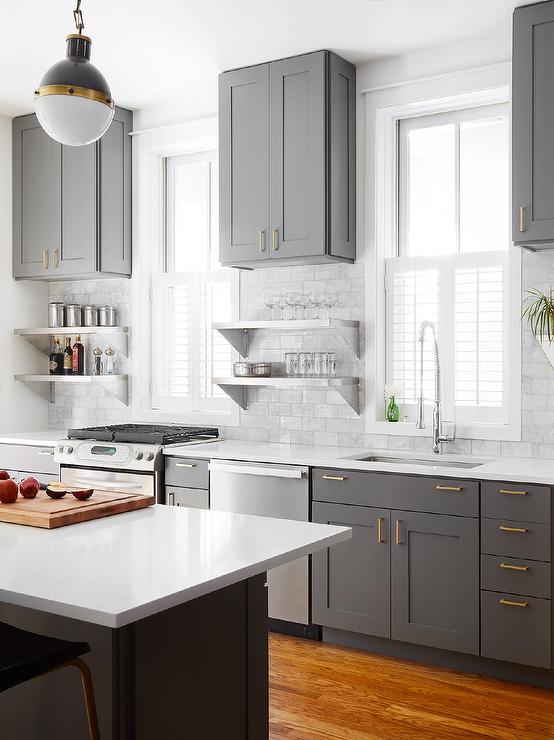 Charcoal gray kitchen cabinets with natural brass pulls #kitchen #graycabinets #graypaint #graykitchencabinets #homedecor #decoratingideas #decorhomeideas