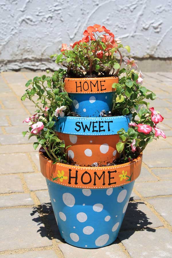 Colorful home sweet home tiered flower pot idea. #flowerpot #planter #gardens #gardenideas #gardeningtips #decorhomeideas