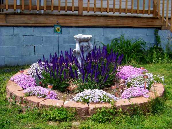 Small flower garden in purple with fountain. #gardens #gardening #gardenideas #gardeningtips #decorhomeideas