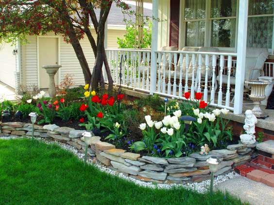 Backyard garden edging with small flowers and tulips. #gardens #gardening #gardenideas #gardeningtips #decorhomeideas