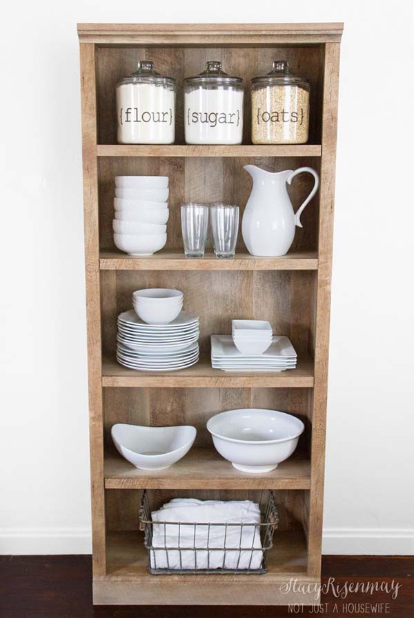 Wooden bookshelf turned into farmhouse kitchen storage #farmhouse #farmhousedecor #storage #organization #farmhousestorage #decorhomeideas