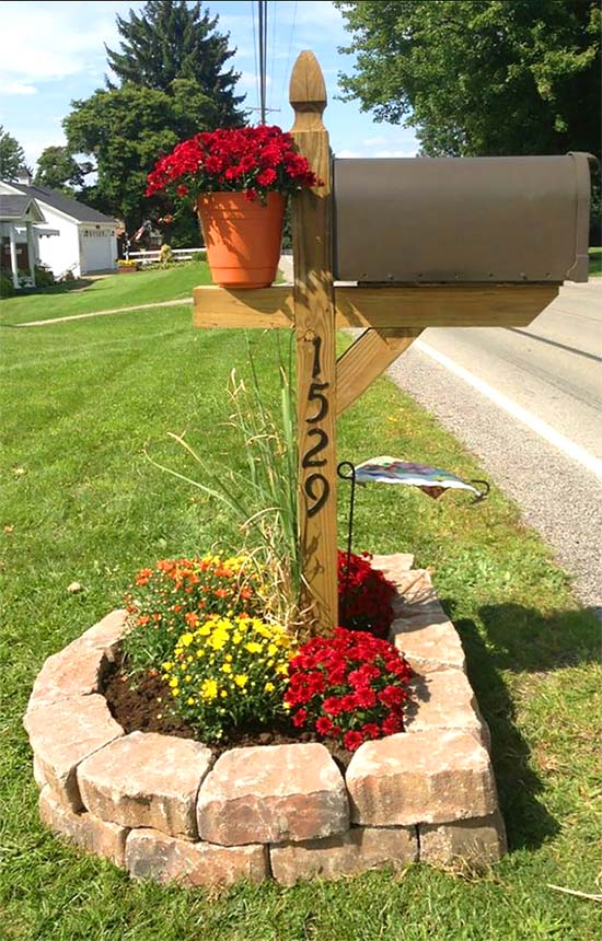 Stone raised flower bed around mailbox #flowerbed #mailbox #garden #curbappeal #flowers #decorhomeideas