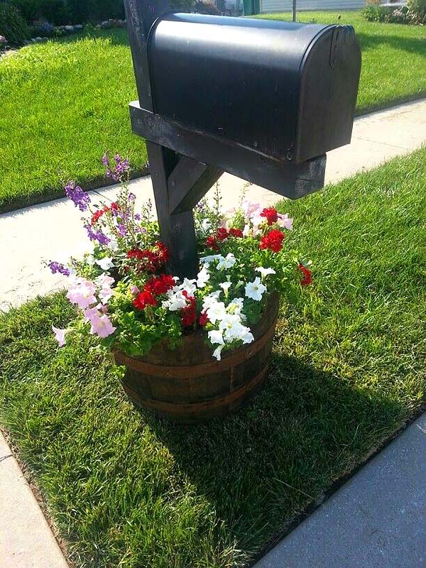 Whisky barrel diy flower bed around mailbox #flowerbed #mailbox #garden #curbappeal #flowers #decorhomeideas