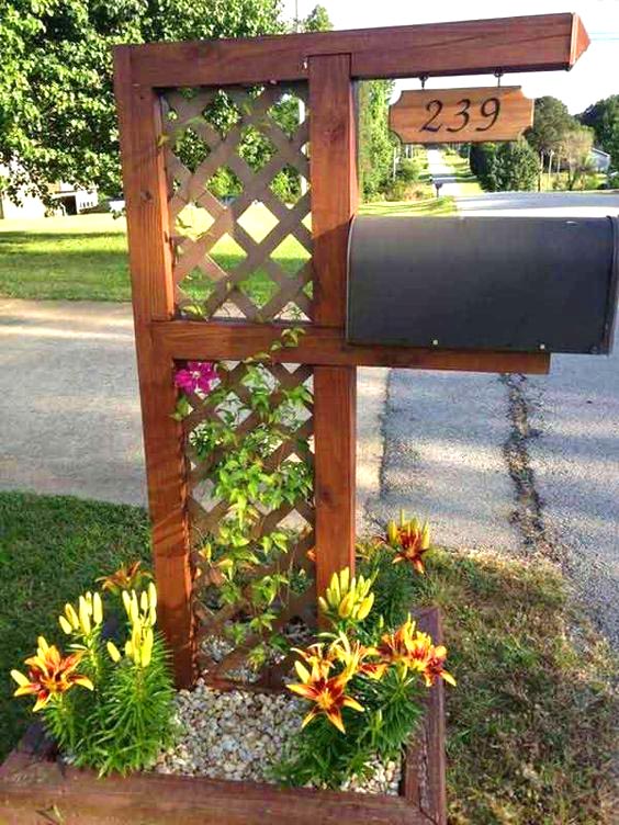 Wooden flower planter around mailbox #flowerbed #mailbox #garden #curbappeal #flowers #decorhomeideas