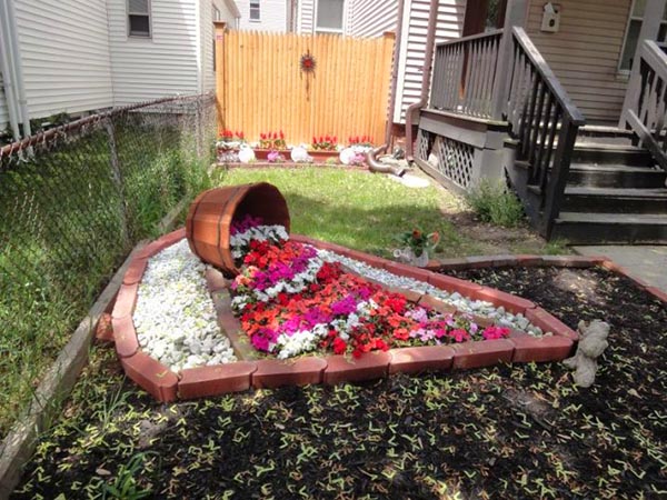 Wine barrel brick flower bed #diy #winebarrel #flowerplanter #repurpose #decorhomeideas