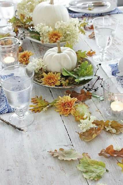 Fall leaves and pumpkin centerpiece #pumpkindecor #centerpiece #falldecor #decorhomeideas