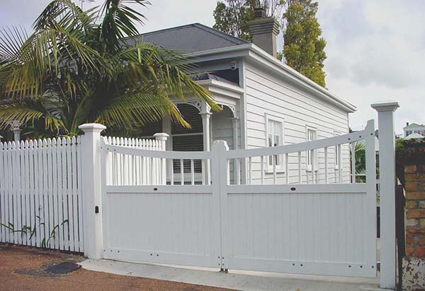 White wooden driveway gate 