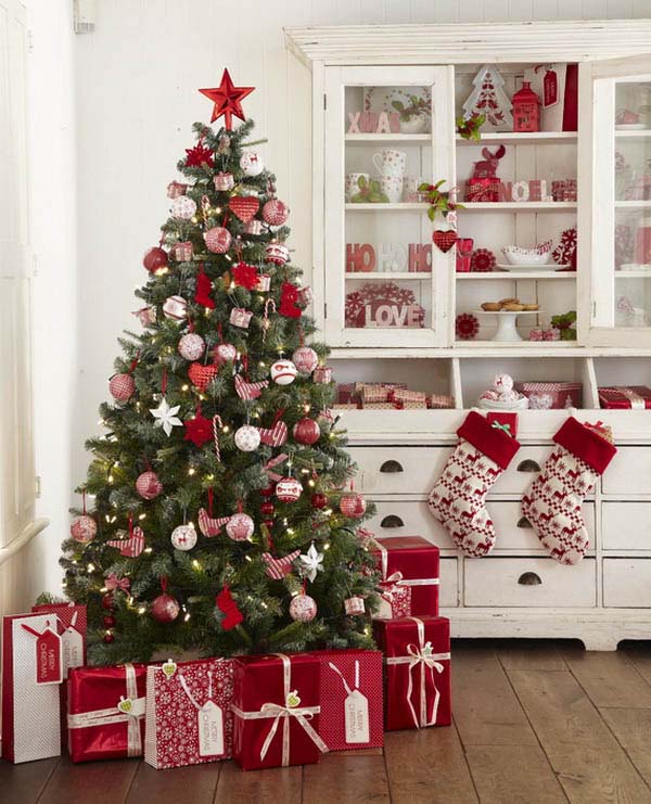 Christmas Tree and Red Wrapped Gifts In Kitchen