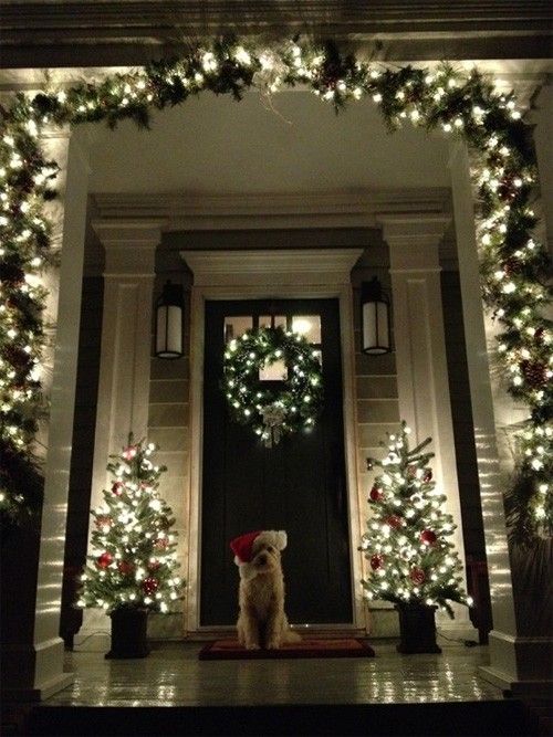 Christmas door decorations with garlands and lights