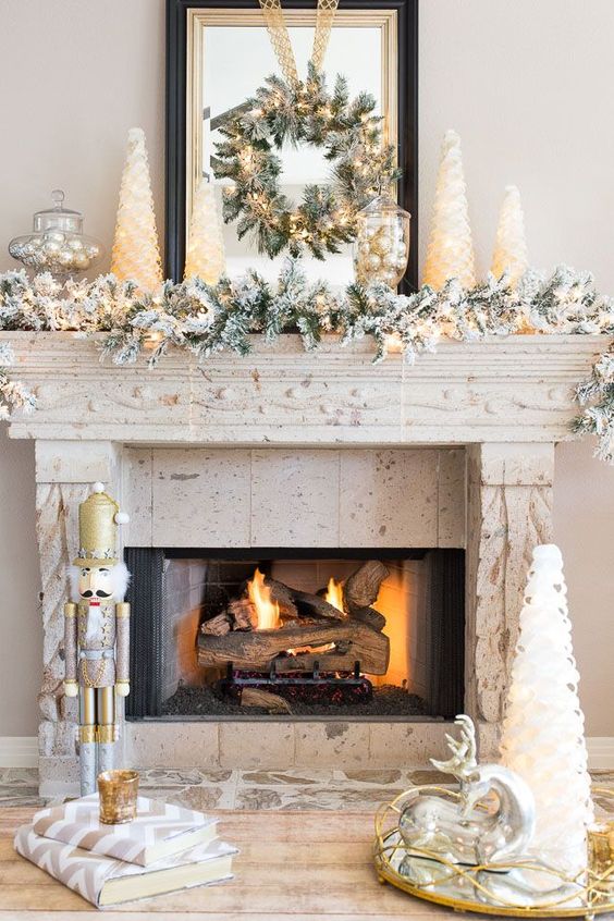 Fireplace Mantel Decorated For Christmas In Gold And Silver