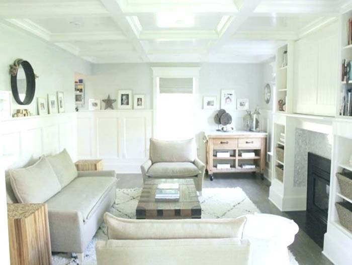 All White Living Room With Wainscoting Wall