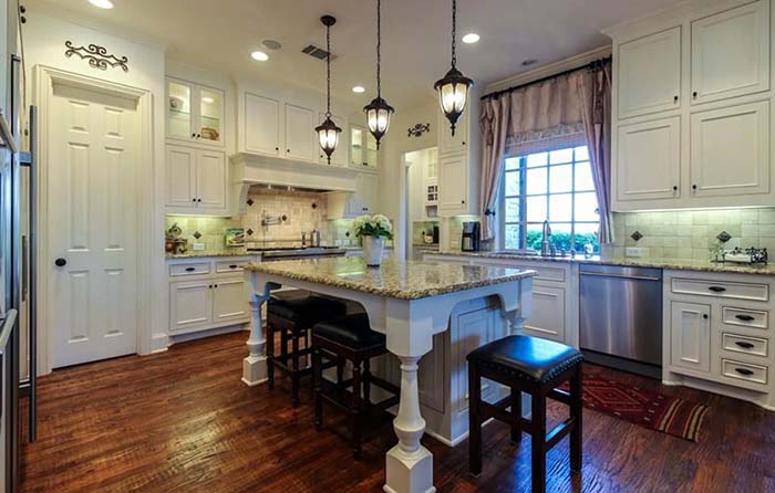 Antique White Kitchen Cabinets Paired With Dark Floor