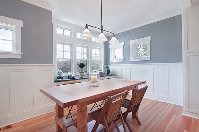 Bright Dining Room With Wainscoting Wall