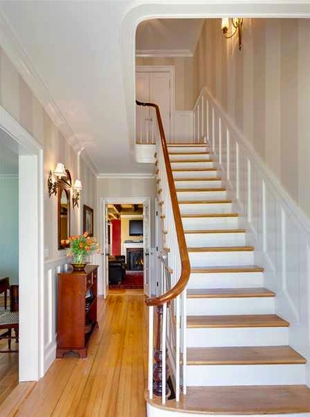 Light Staircase With Wainscoting Wall