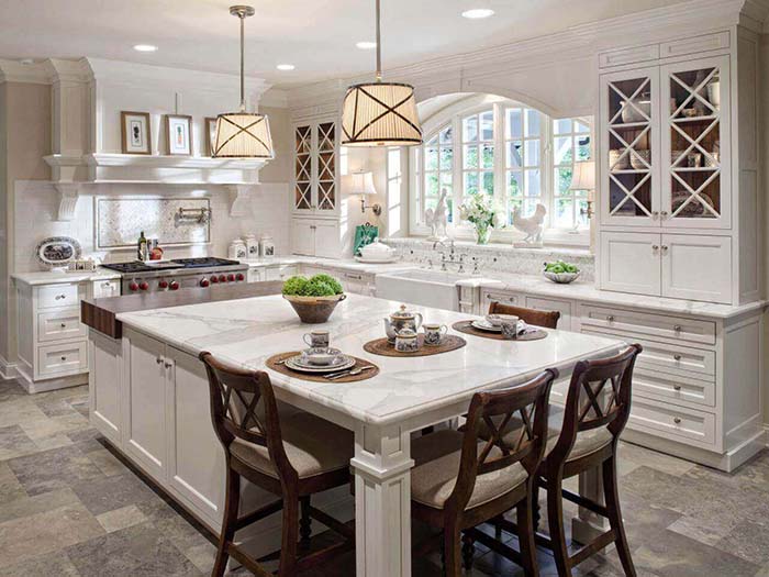 Luxury Antique White Kitchen With Island and wooden chairs