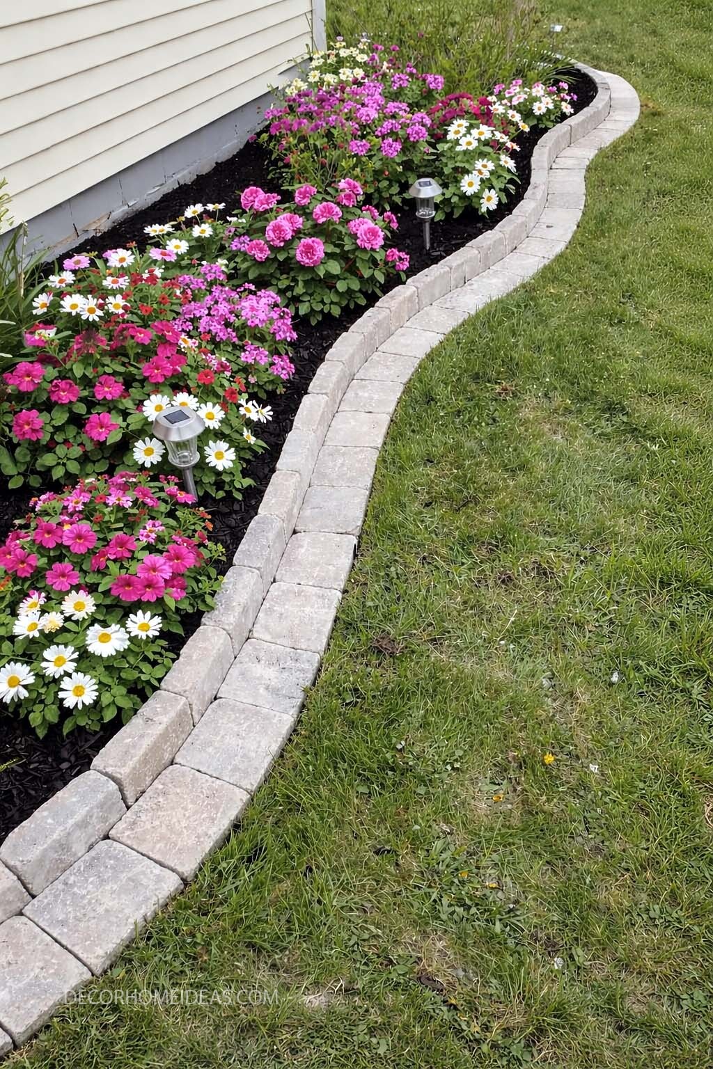 Colorful Front Flower Bed with Curved Stone Edging