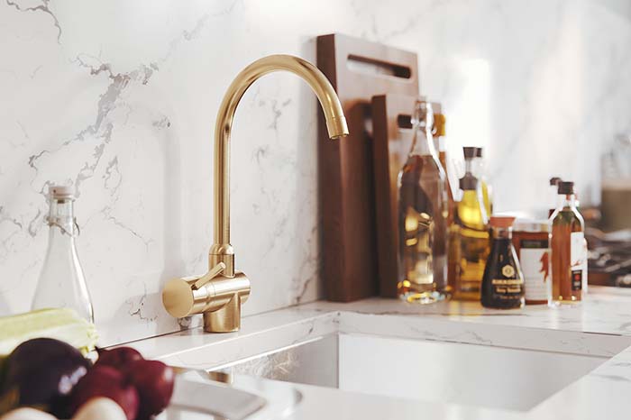 Brass Faucet Incorporated In Blue Kitchen Design