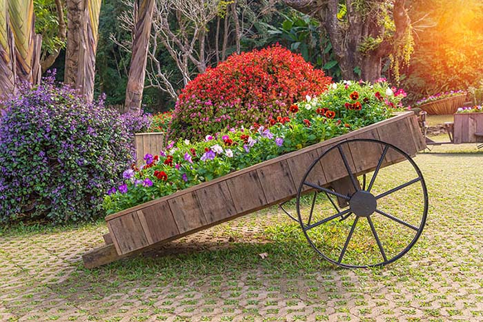 Repurposed trolley used for flower bed #flowerbed #gardens #decorhomeideas