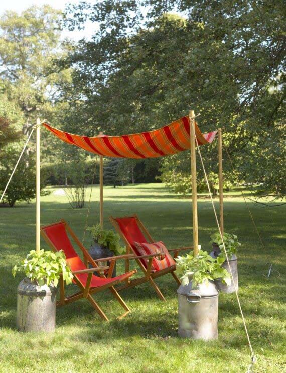 Easy Tent-Style Awning with Milk Can Anchors #diy #sunshade #patio #backyard #pergola #decorhomeideas