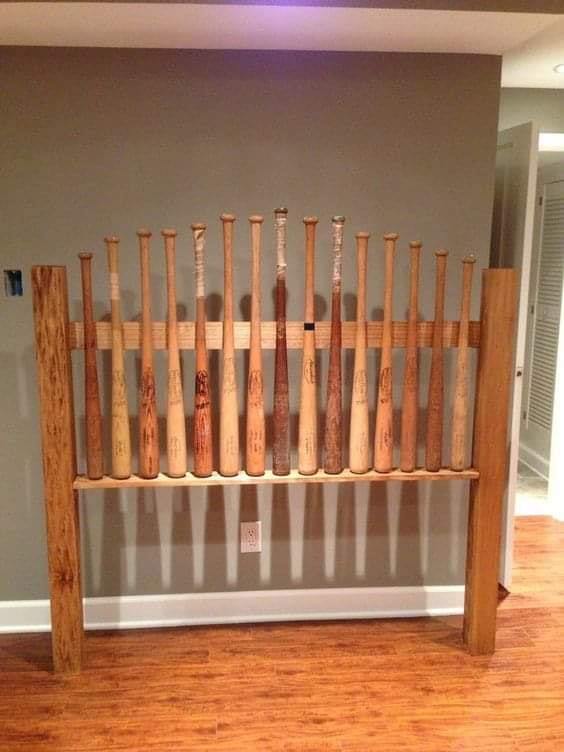 Repurposed Baseball Bats Headboard. Creative use of baseball bats to make a wooden headboard. You can glue or nail them for extra durability. #headboard #bedroom #homedecor #decorhomeideas