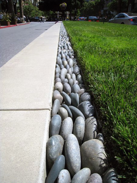 Stone Edging Smooth River Rock Border Sidewalk And Grass