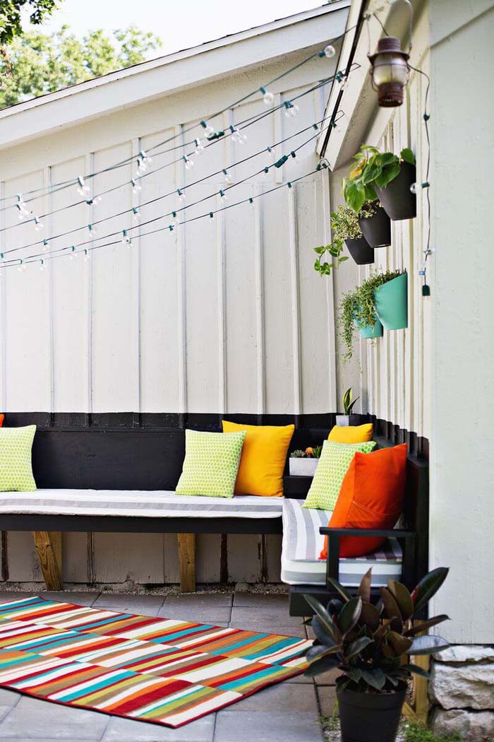 Wall of Pots and Curtain of Lights #diy #porch #patio #projects #colorful #decorhomeideas