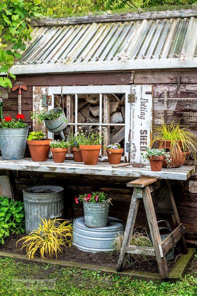 Easy Upcycled Door and Sawhorse Potting Table #diy #potting #bench #garden #decorhomeideas