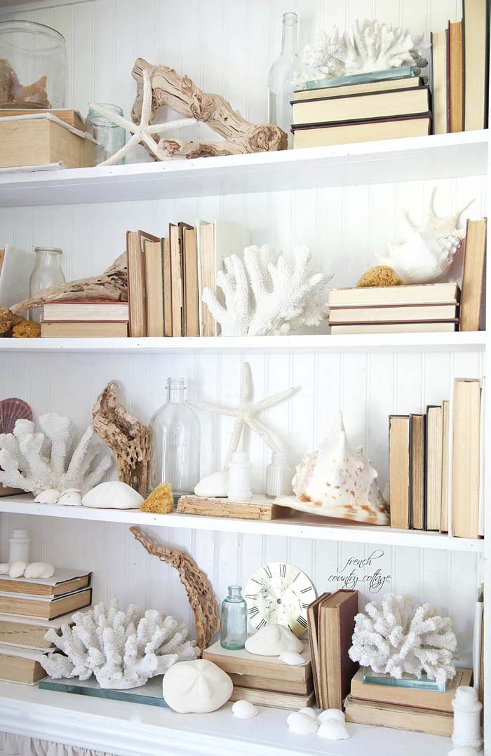 A Bookcase Crawling with Coral and Shells #beach #coastal #decoration #decorhomeideas