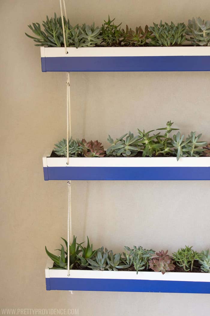 DIY Hanging Gutter Planter #diy #decor #porch #decorhomeideas