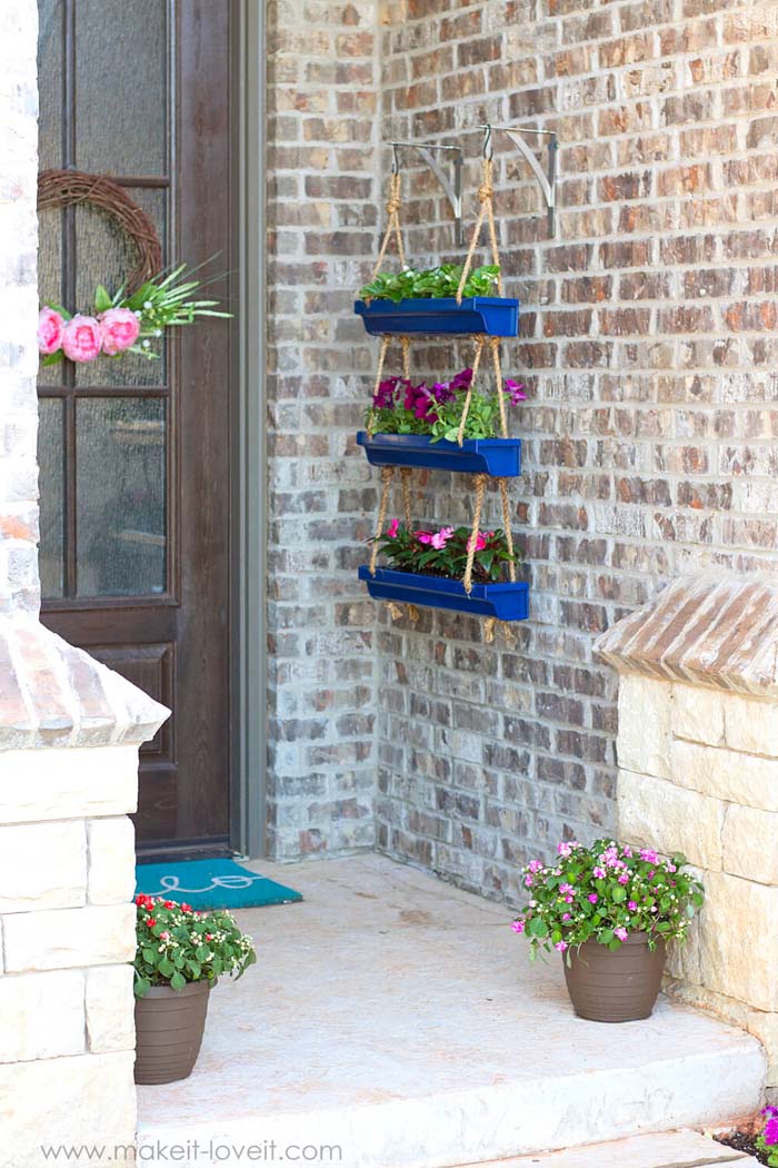 DIY Hanging Rain Gutter Planters #diy #planter #porch #decorhomeideas