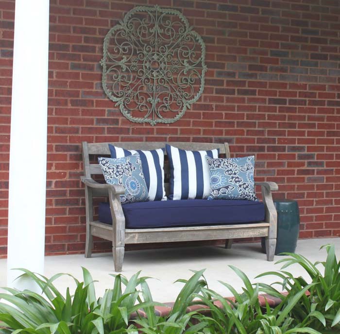 Metal Scrollwork Wall Hanging Over a Bench #porch #wall #decor #decorhomeideas