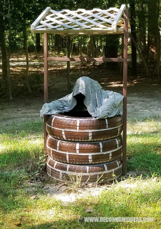 Garden Ghost Climbing Out of Well Made of Old Tires