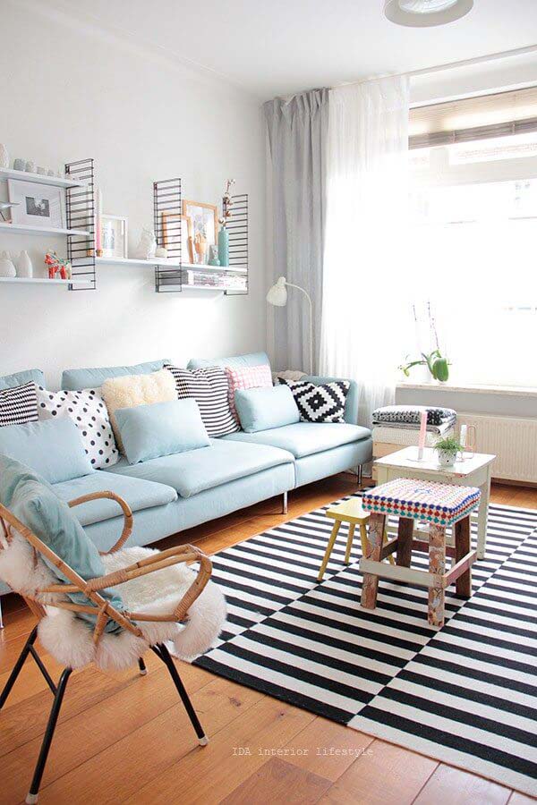 Sky Blue Sofa with Bold Striped Rug #livingroom #design #decorhomeideas