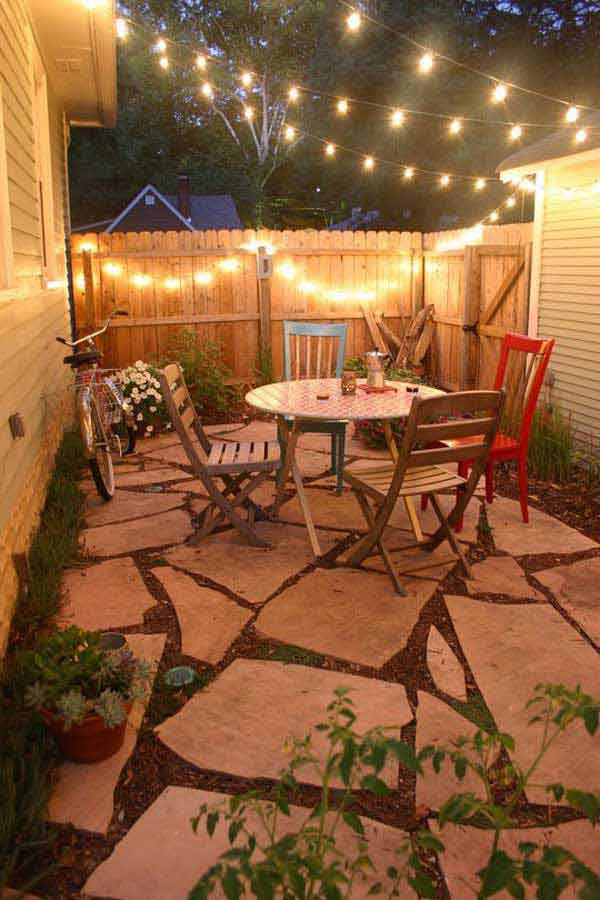 Cozy Patio Dining Area with Fence Lights #stringlight #garden #yard #decorhomeideas