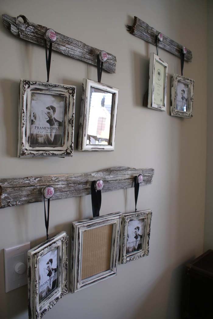 Distressed Frames Hanging from Reclaimed Wood #rustic #livingroom #walldecor #decorhomeideas