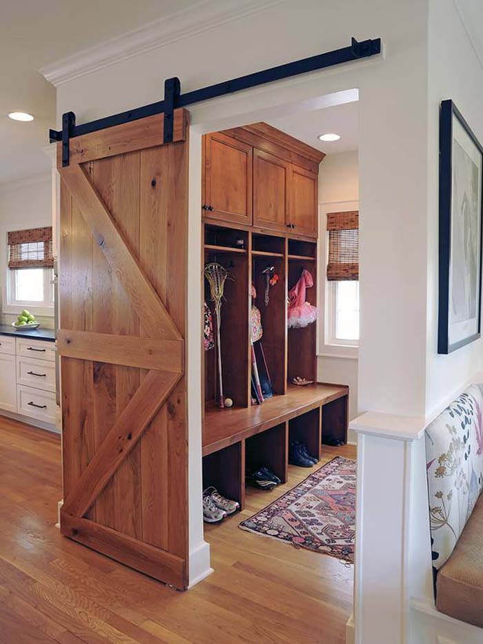 Wooden Barn Door And Rustic Feel #storage #mudroom #organization #decorhomeideas