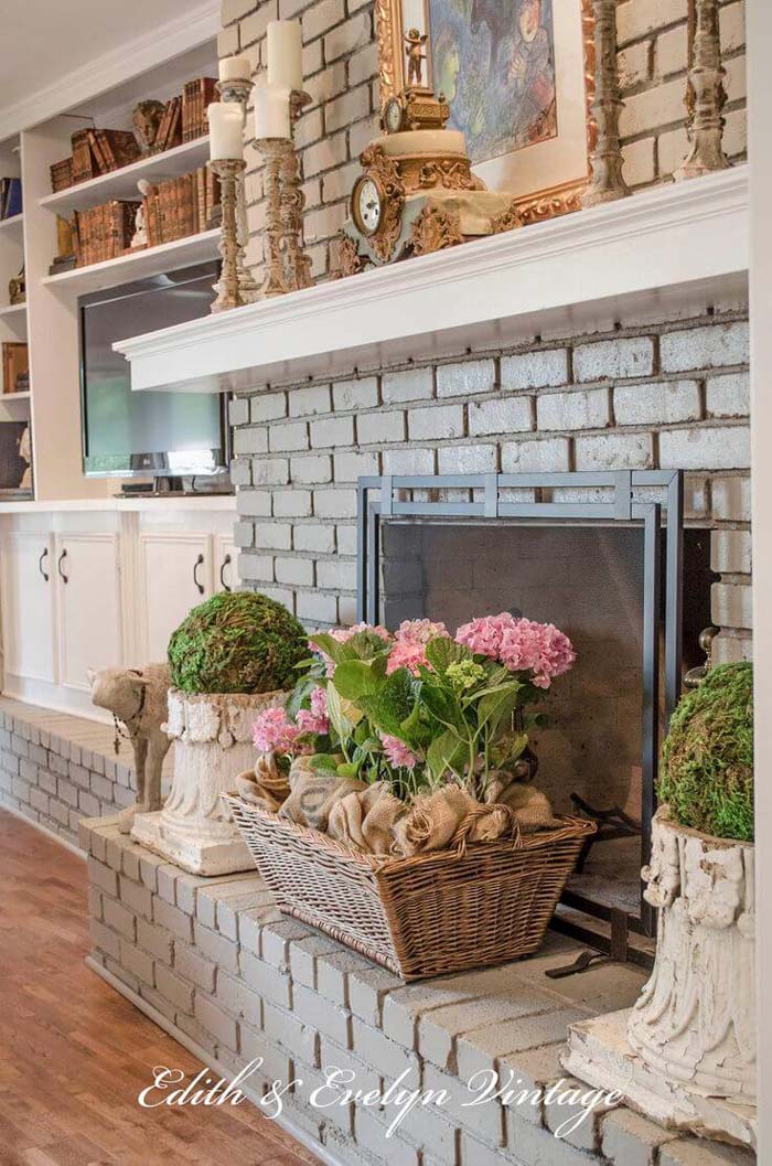 Grey Brick Fireplace with Potted Spring Flowers #frenchcountry #decor #decorhomeideas