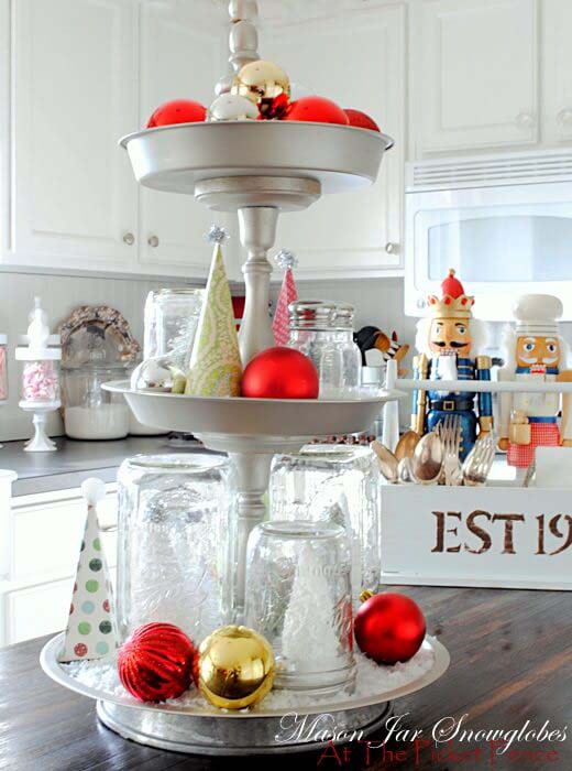 Mason Jar Snow Globes On A Three-tiered Tray #Christmas #cakestand #decorhomeideas