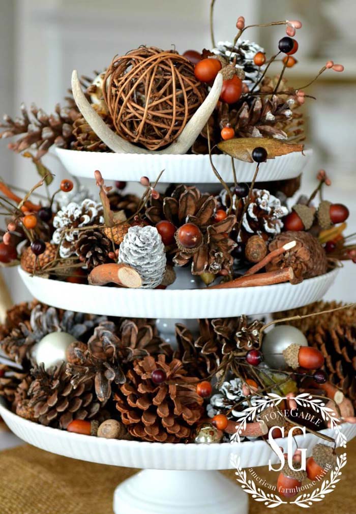 Rustic Tiered Display With Backyard Finds And Frosted Pinecones #Christmas #cakestand #decorhomeideas