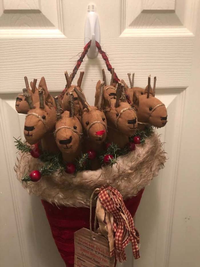 Primitive Reindeer Nestled Inside a Santa Hat #Christmas #reindeer #decorhomeideas