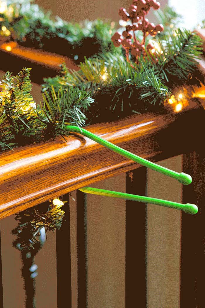 Use Cable Organizers to Attach Garland #Christmas #hanginghacks #decorhomeideas