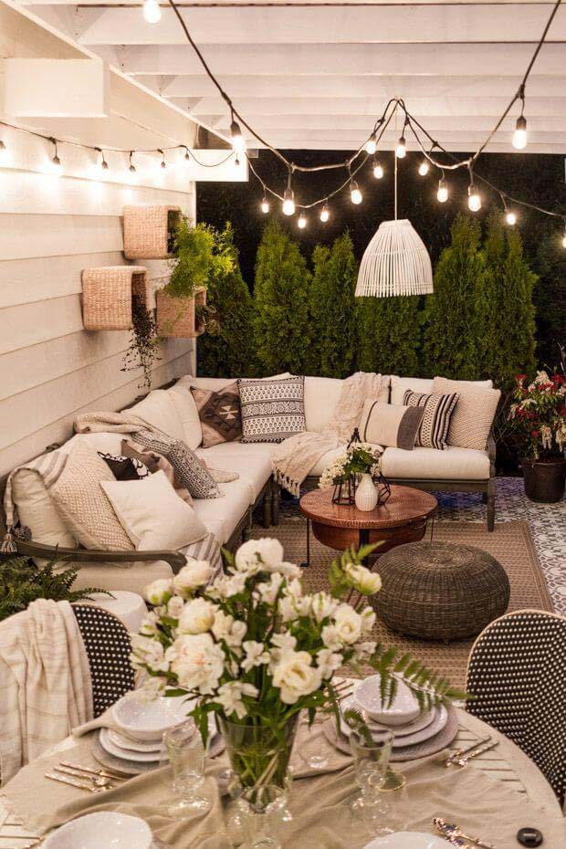 Clean White Walls, Fabric, and Bulbs Lighten this Outdoor Space #lighting #yard #outdoor #decorhomeideas