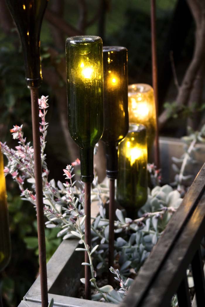 Green Glass Bottles Reborn as Gorgeous Torches #lighting #yard #outdoor #decorhomeideas