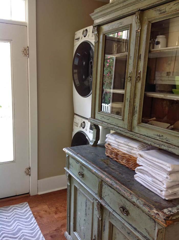 Repurposed Dining Hutch Turned Laundry Cabinet #masonjarlights #masonjar #decorhomeideas